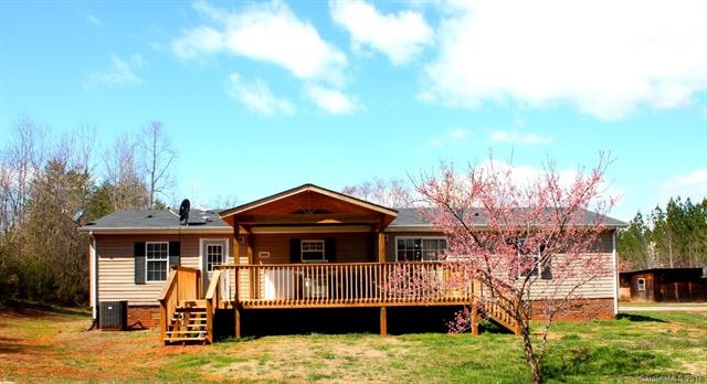 Back of home. Great new covered deck area