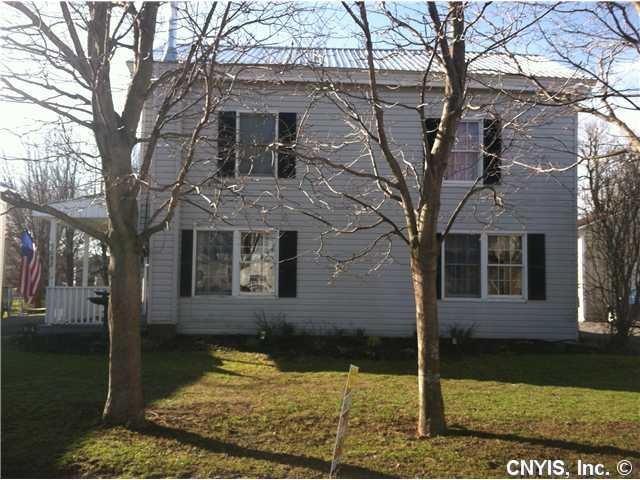 Exterior Front Spacious village home with paved ci
