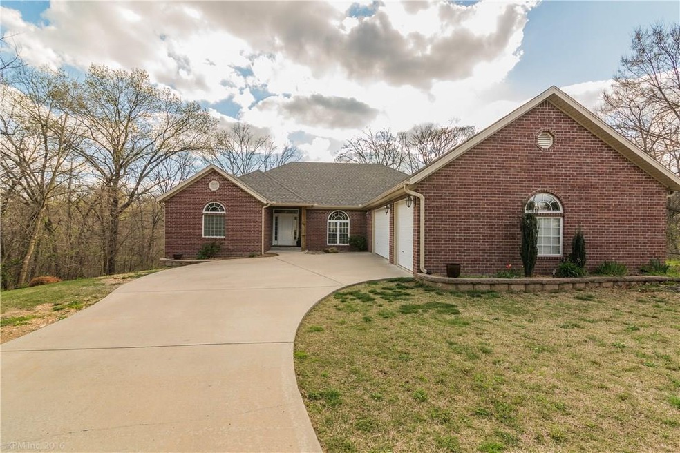 Lovely brick home with side load three car garage.