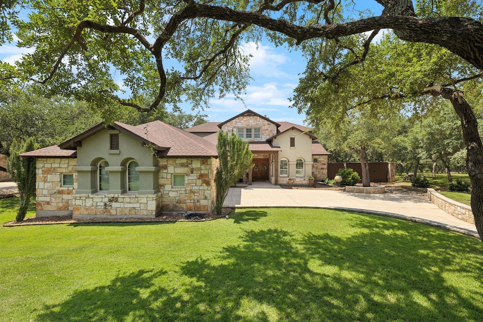 View of front facade featuring stone siding, stuc