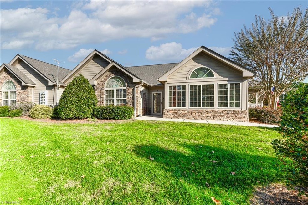 Front entrance overlooking private green space with privacy plantings