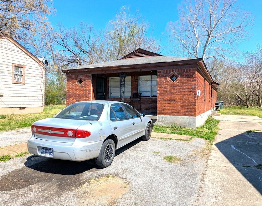 Exterior space featuring brick siding