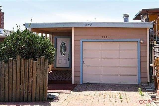 Cute beach cottage with a single car garage and on