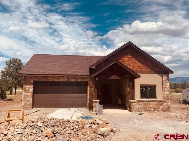 Real stone, metal, stucco for a mountain modern lo