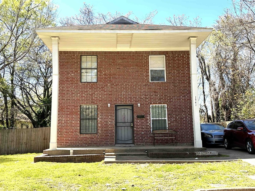 View of front of home with covered porch and a fro
