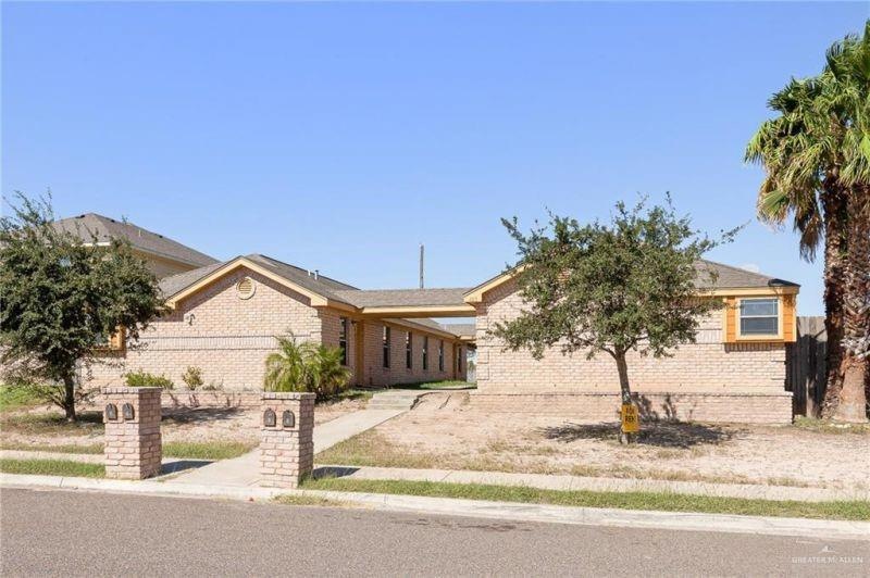 Ranch-style home with brick siding