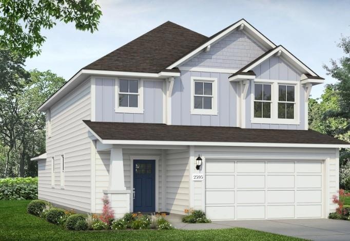 View of front of home with an attached garage, co