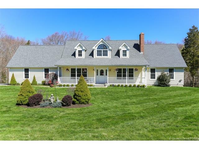 Beautiful design with covered front porch and atri