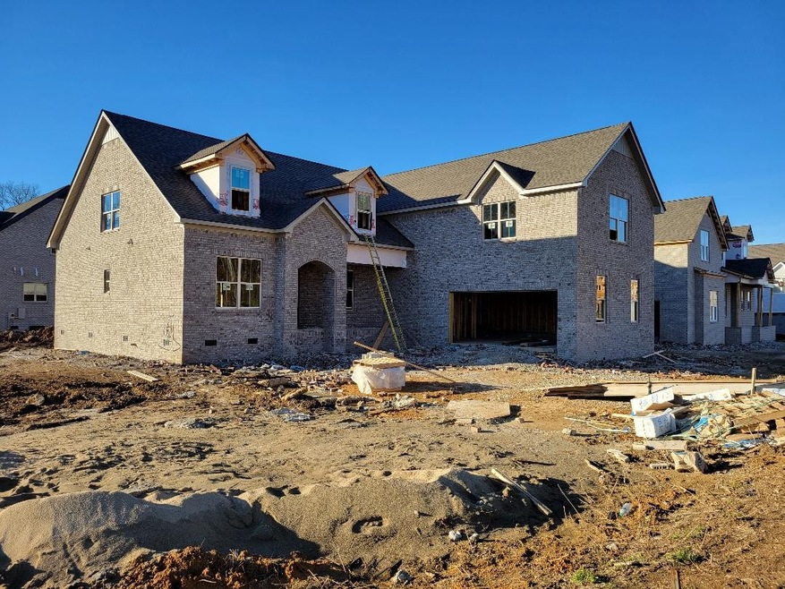 Actual home for sale. Corner lot; courtyard entry garage. 