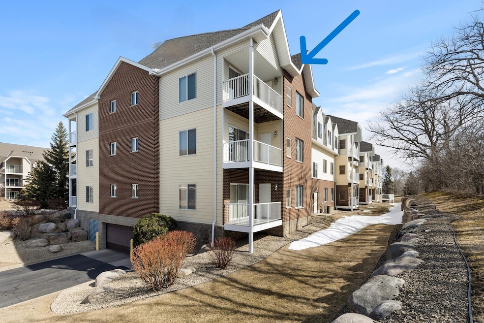 Top floor corner unit facing trees & green space