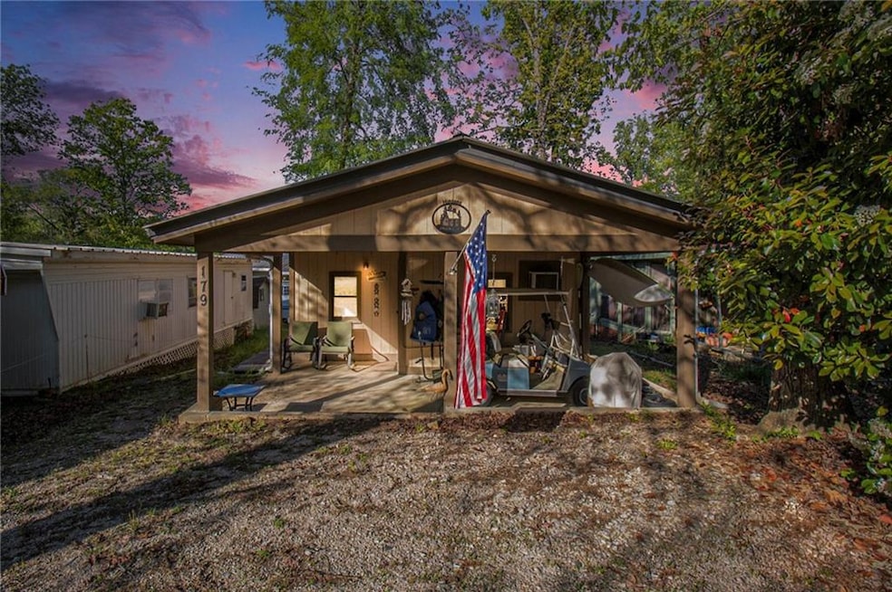 Back of house at dusk with a patio
