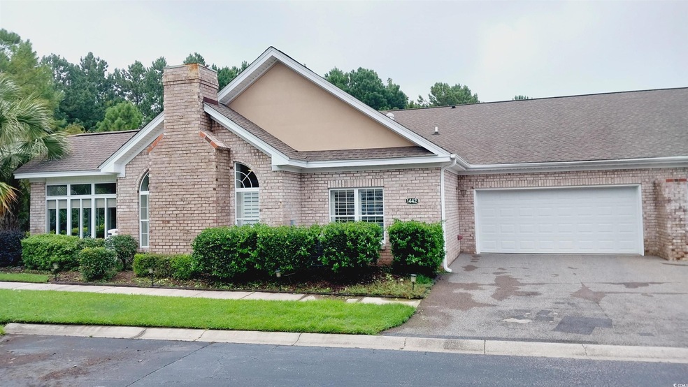 Ranch-style home with a garage