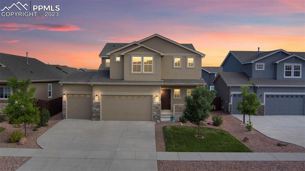 Amazing stucco and stone home with welcoming front porch!