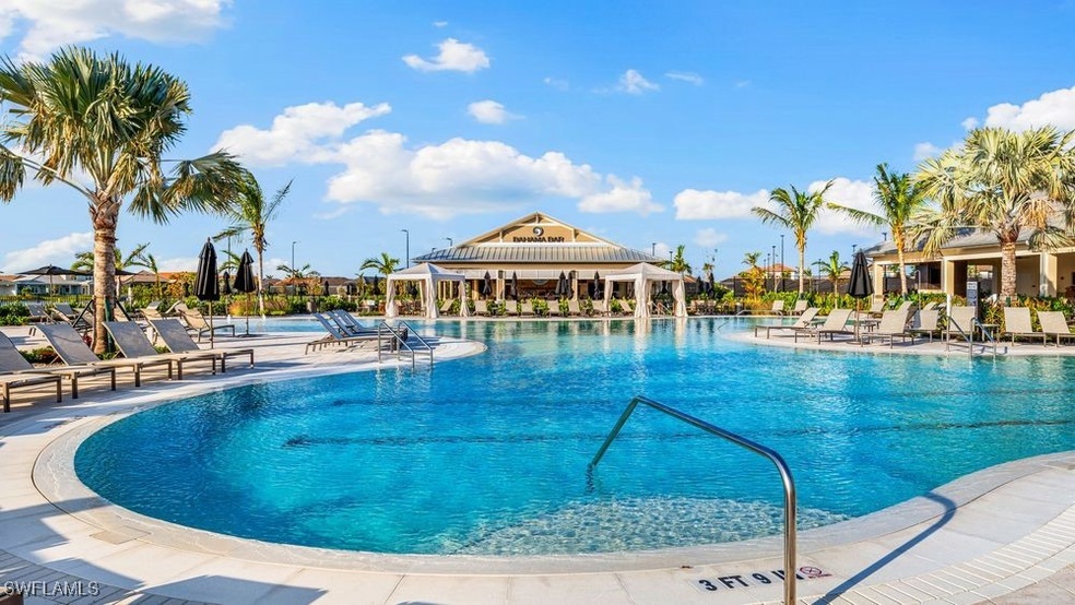 Community pool with a patio