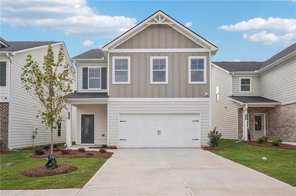Traditional-style house with an attached garage, a