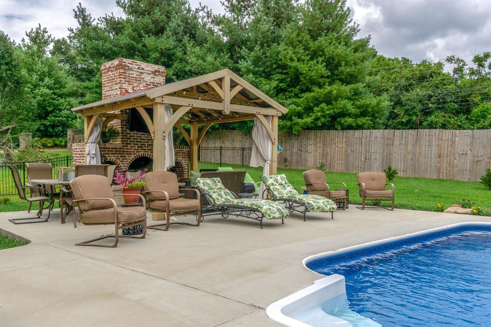 Can't you picture yourself enjoying the covered outdoor fireplace !