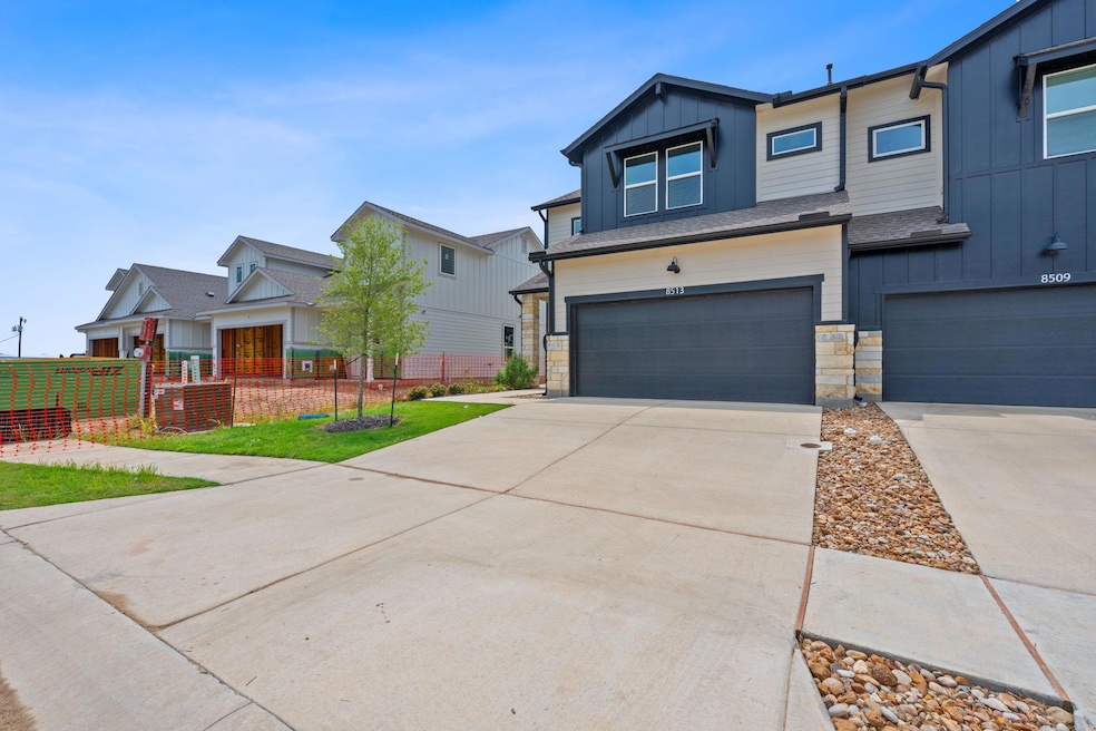 View of front of property with a garage, fence, s