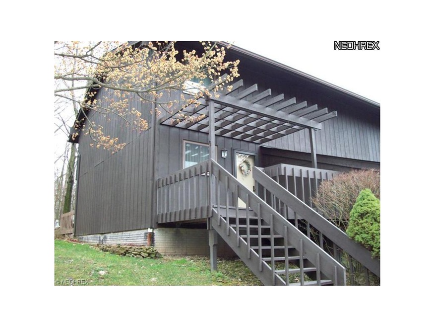 Exterior front showing porch and part of back deck