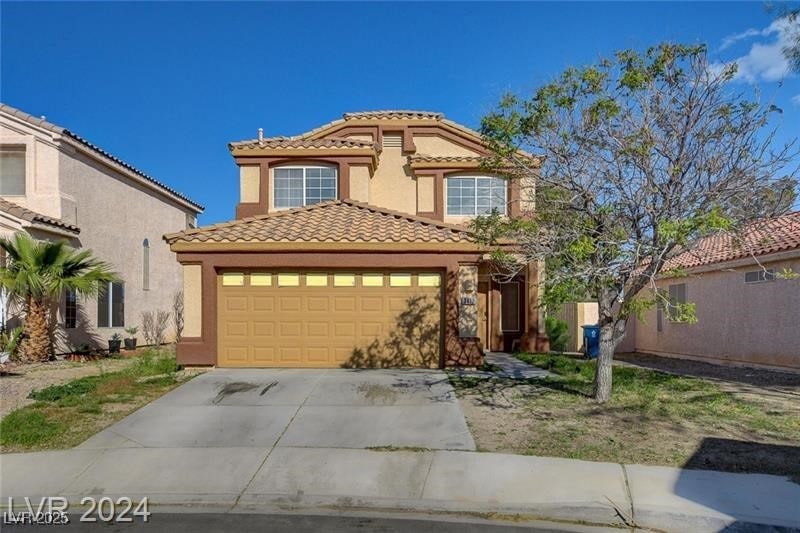Mediterranean / spanish-style home with a tile roo
