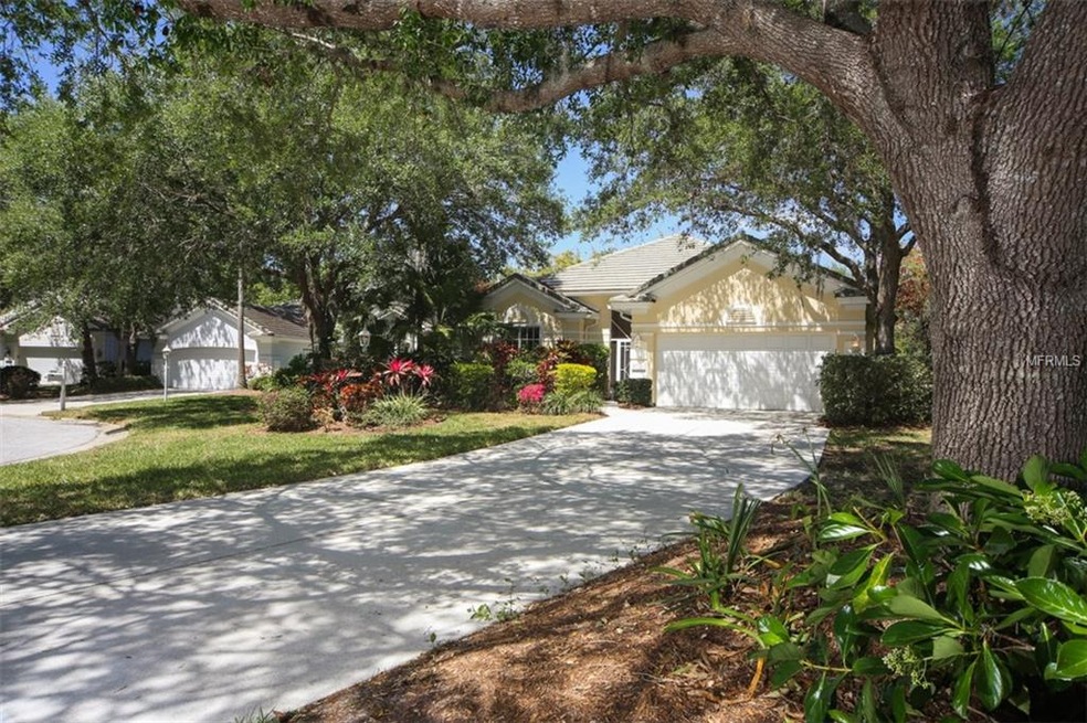 Exterior front of home with majestic oak trees and