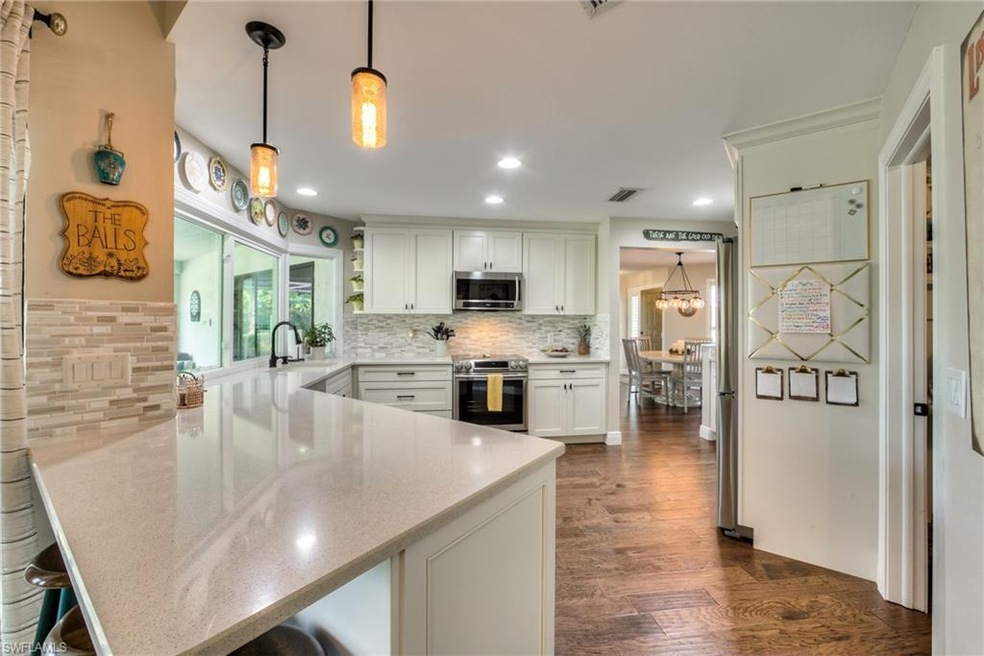 Breakfast bar in kitchen and beautiful white shaker cabinets