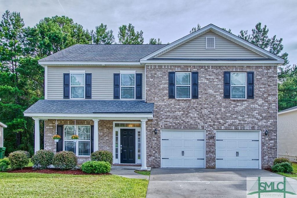Brick front, covered front porch and carriage gara