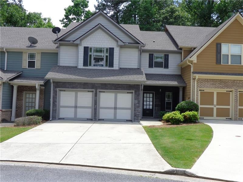 View of the front of the home. Sign has been blurr
