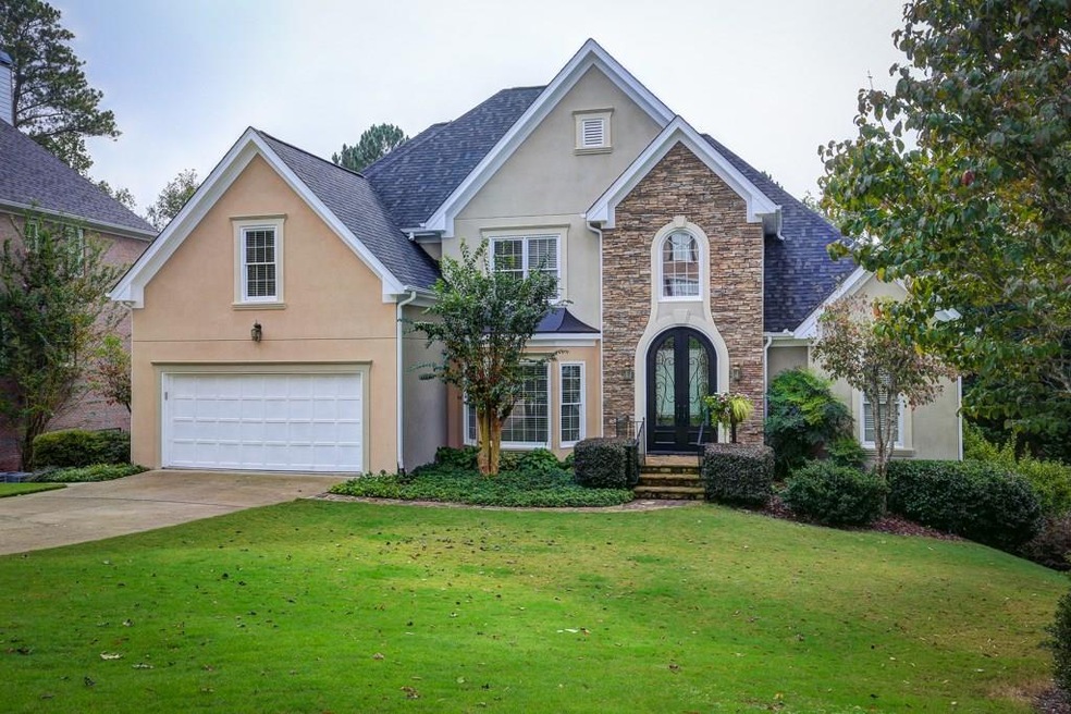 Front of home.  stucco & cement siding.  large iro