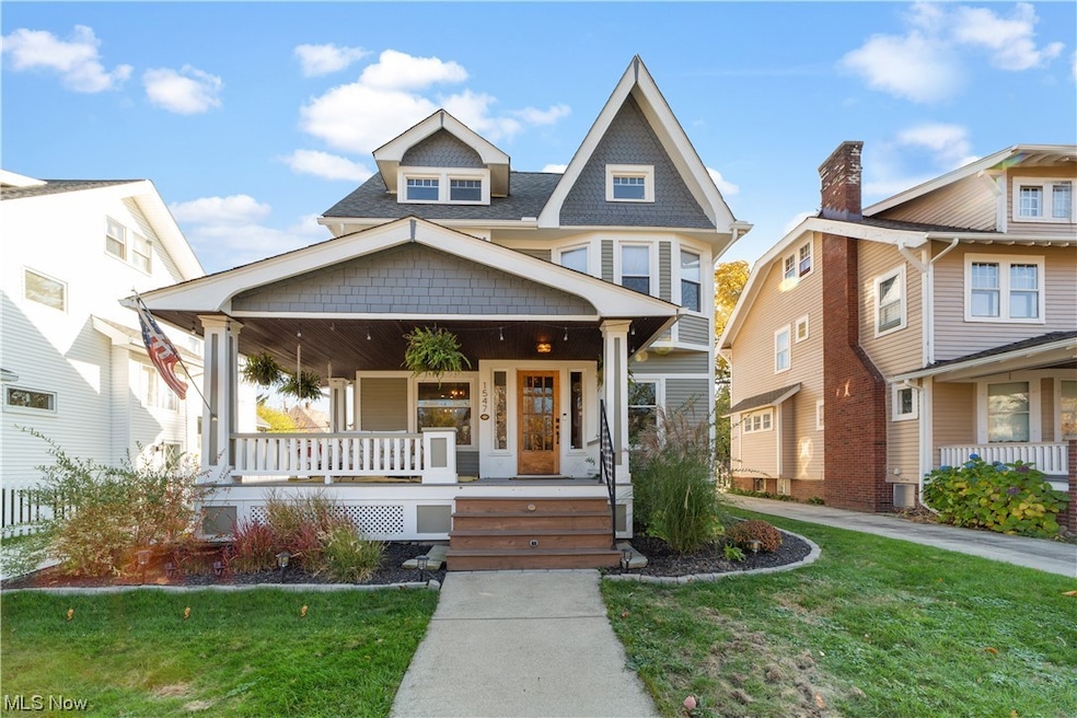 View of front of house featuring a front yard and covered porch