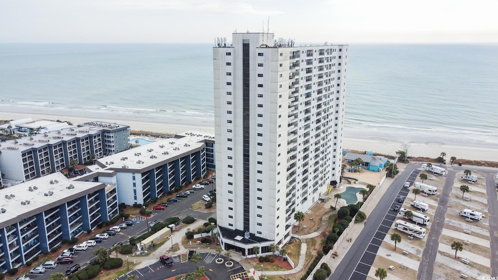 Birds eye view of property with a view of the beac