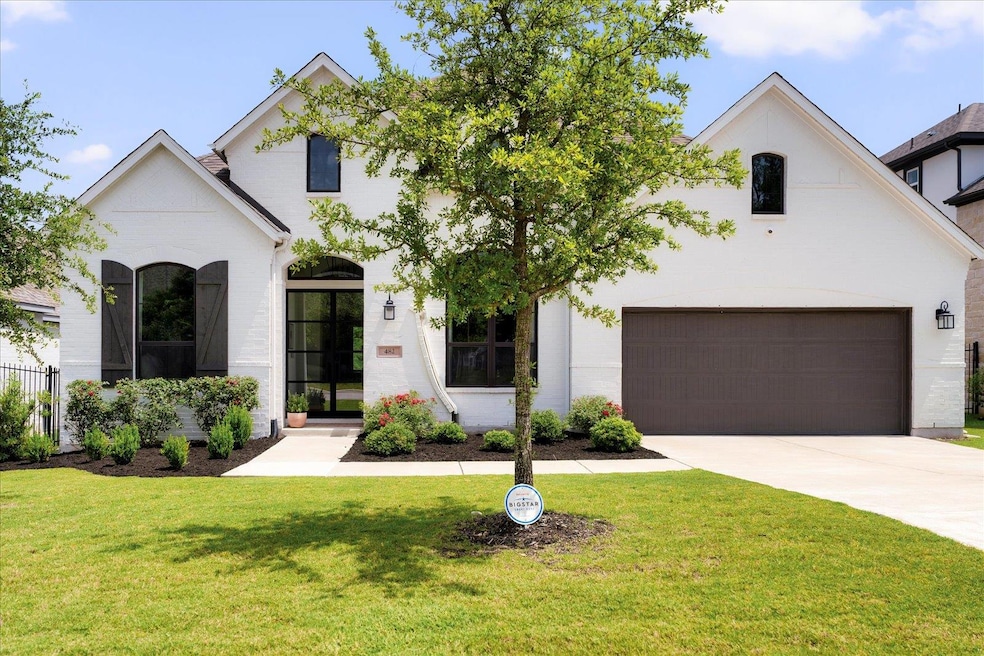 French country style house with a front lawn and 