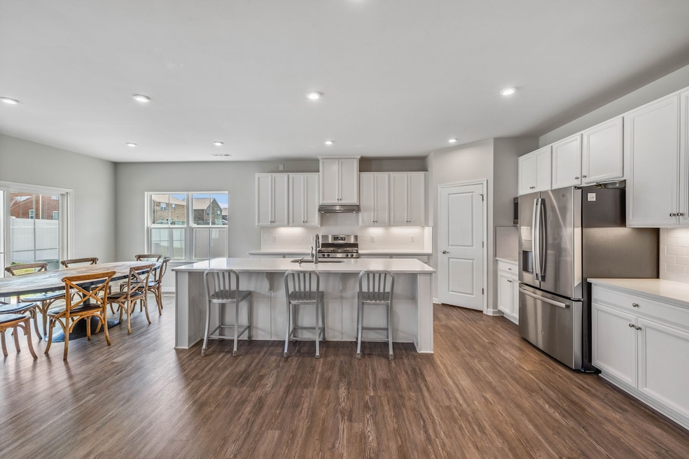 Your fabulous eat-in kitchen is open to the dining area as well as the main living area....you will love the look and feel of this home!