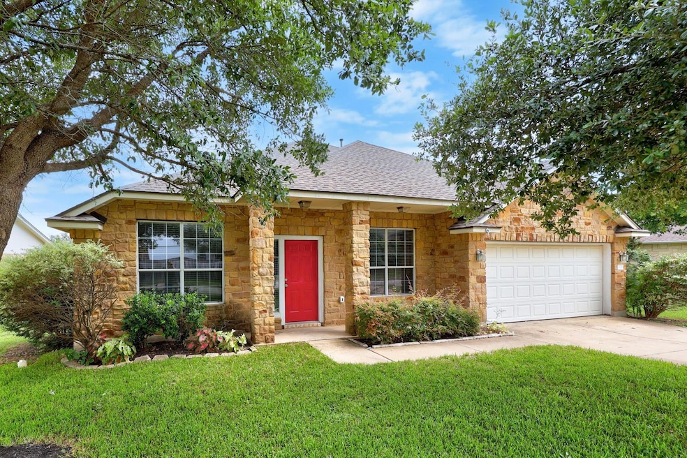 View of front of home with a front yard, roof wit