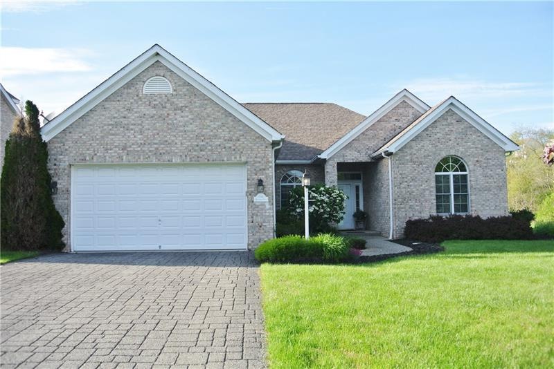 Front of House. Stamped paved driveway.