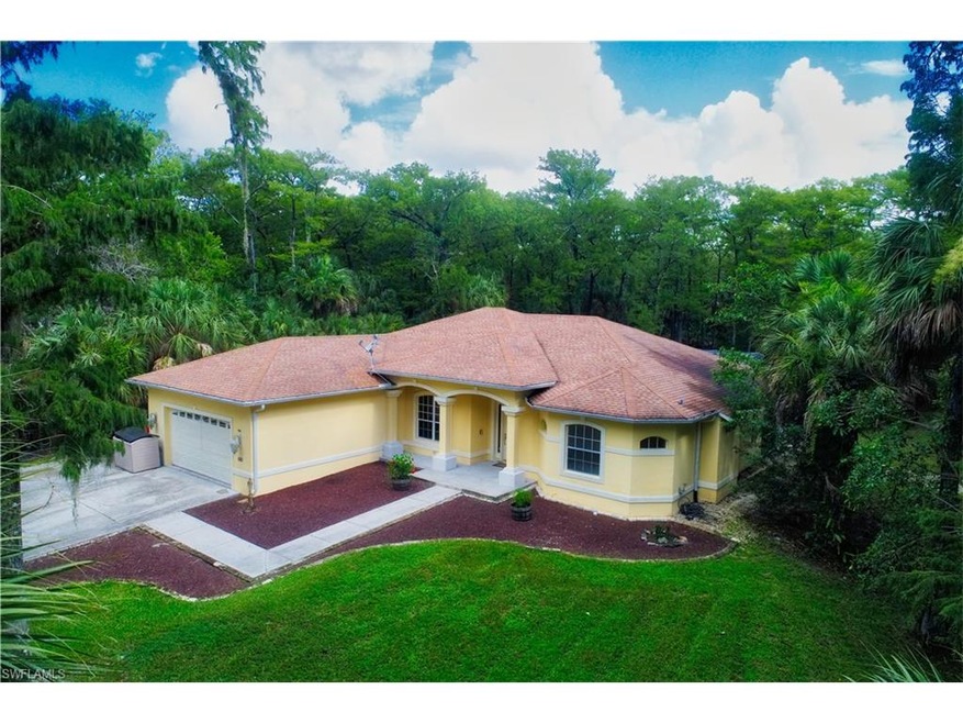 Front angle Elevation, 2-car garage and great landscaping all on 2.73 acres