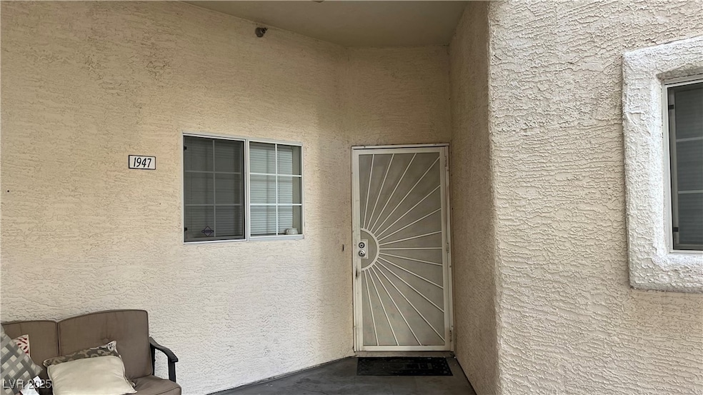 View of exterior entry with stucco siding