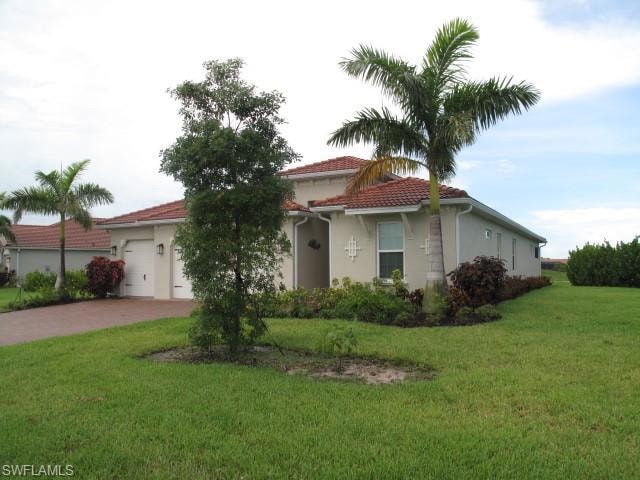 View of front facade with a garage and a front yar