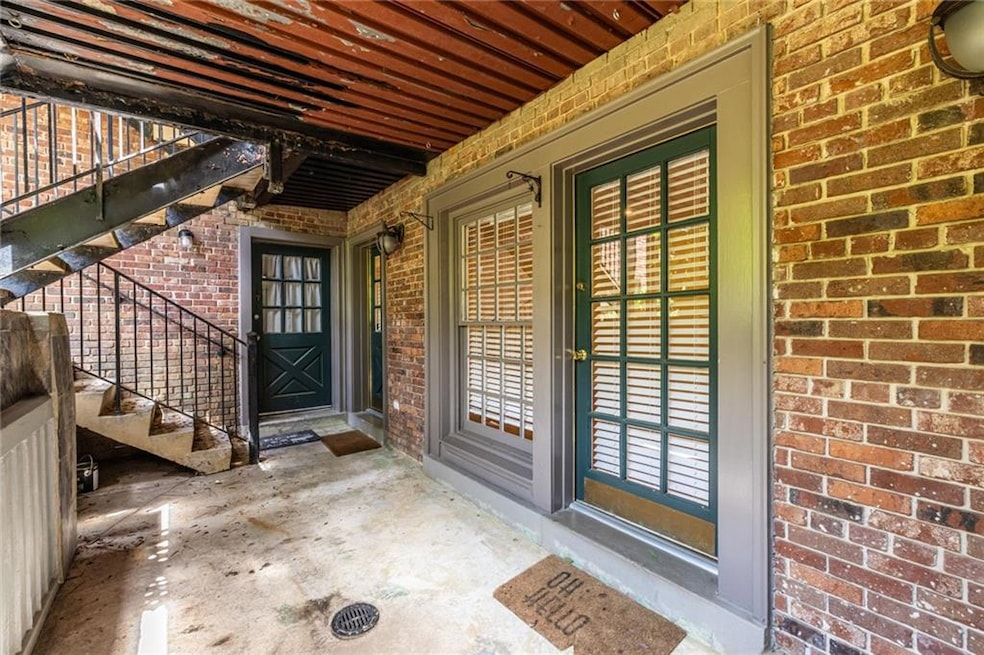 Doorway to property with brick siding