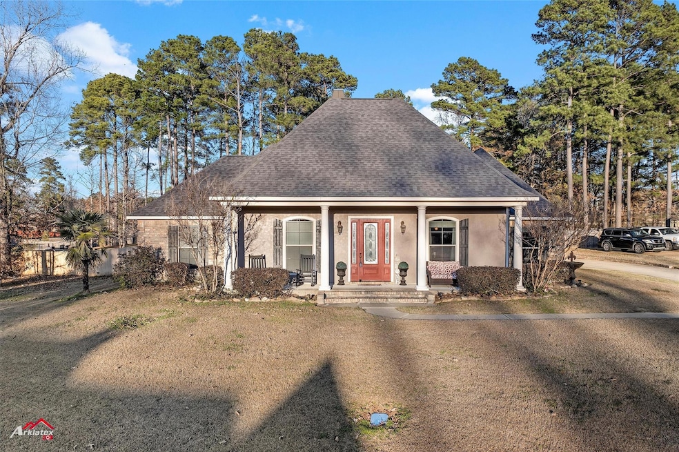 View of front of home with covered porch and a fro