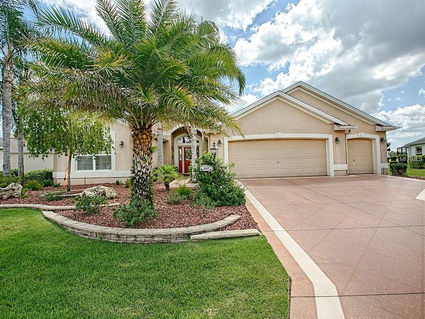 LOVELY CURB APPEAL WITH TROPICAL LANDSCAPING AND P