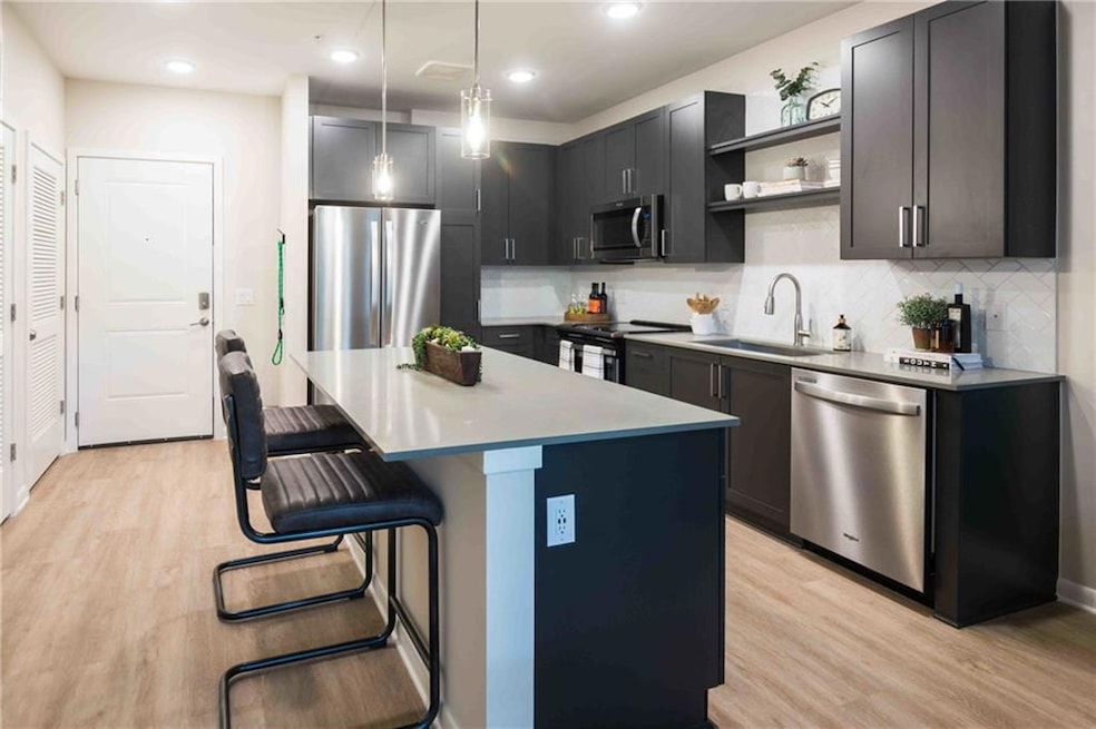 Kitchen featuring appliances with stainless steel 