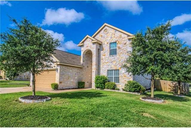 Welcome to this beautiful white stone home nestled
