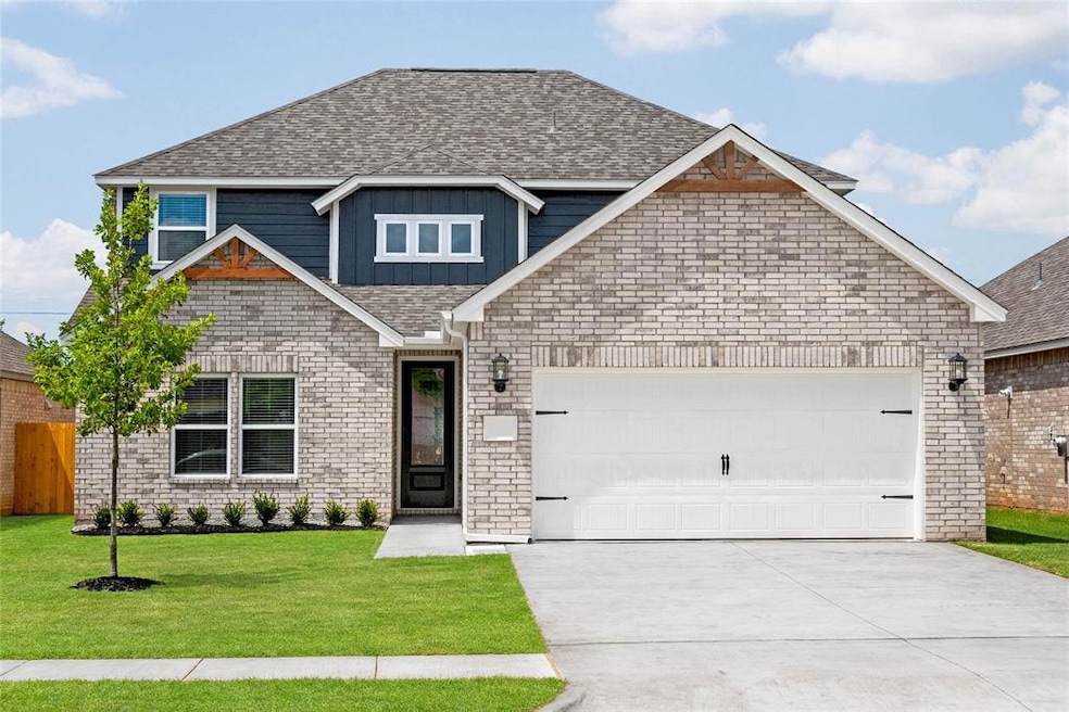Beautiful two-story exterior with modern brick, siding accents and inviting curb appeal.