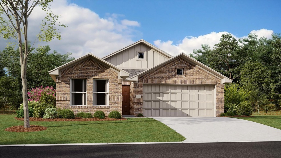 View of front of home with a garage and a front la