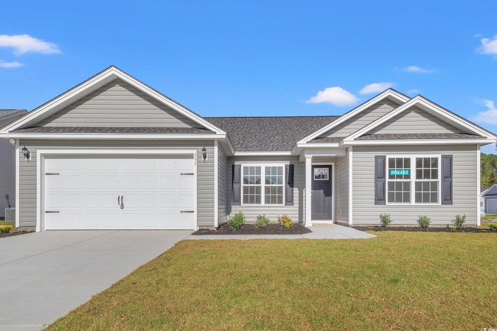 Ranch-style home with an attached garage, roof wit