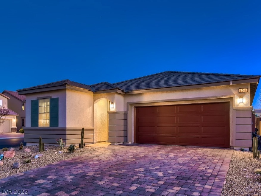 FRONT OF HOME SHOWS PAVERS AND CORNER LOT. CUSTOM