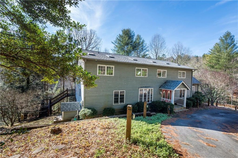 Mountain home situated on the Ellijay River on ove