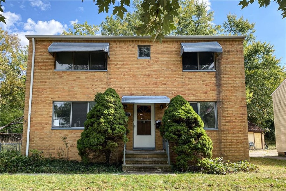 View of front of house with a front yard