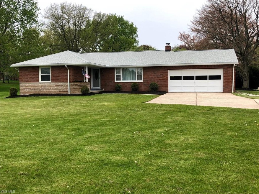 Great curb appeal for the brick and stone exterior