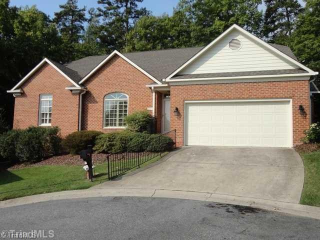 Exterior Front. One story living with private patio overlooking wooded area.